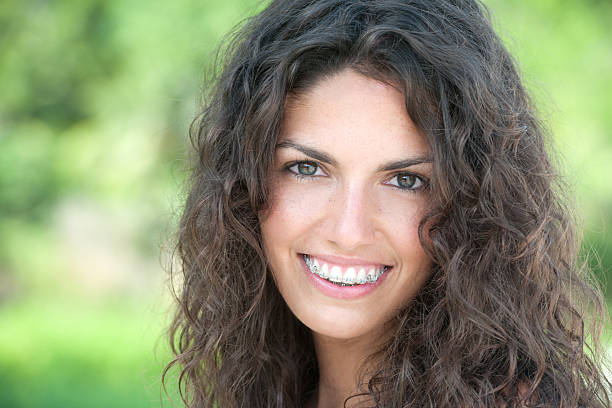 Natural Beauty with Braces, stunning eyes and a perfect candid expression. Nikon D3X. Converted from RAW.